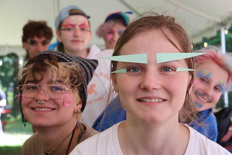 Teens being silly in the art hut.