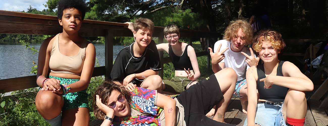 Group of teens posing for a photo at camp.