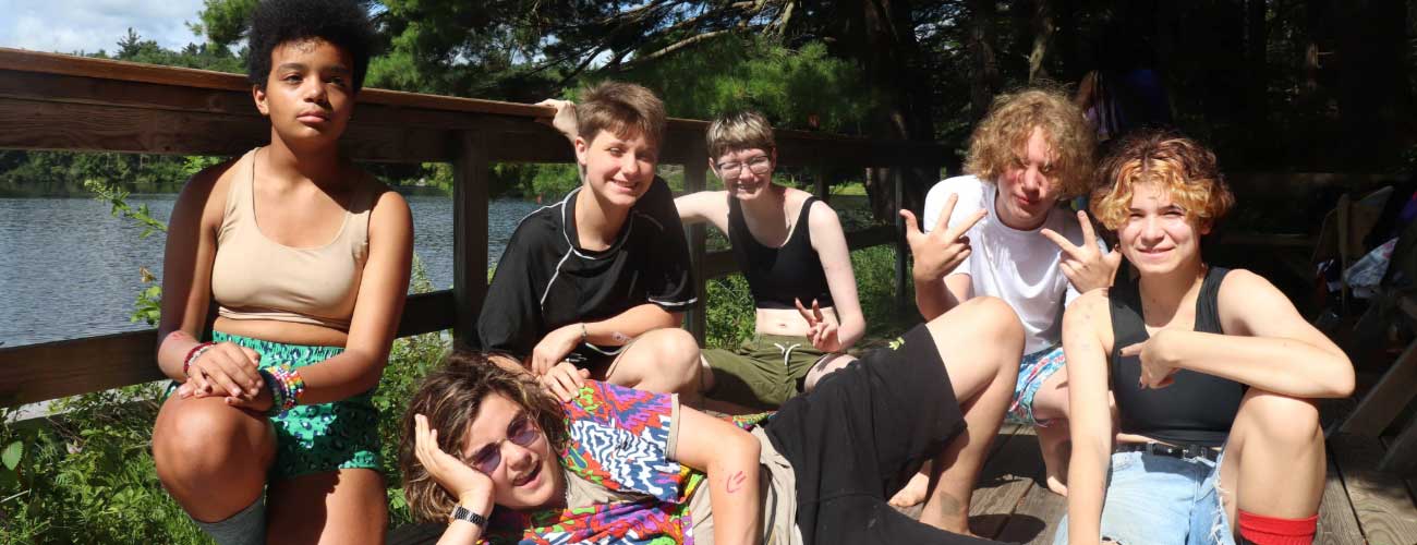 Group of teens smiling and posing for camera